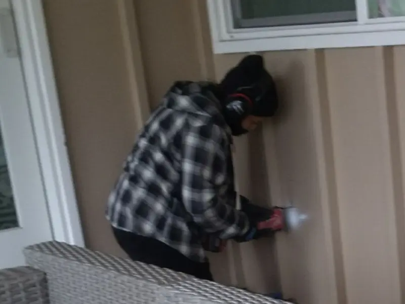 Professional electrician installing an exterior outlet in California City